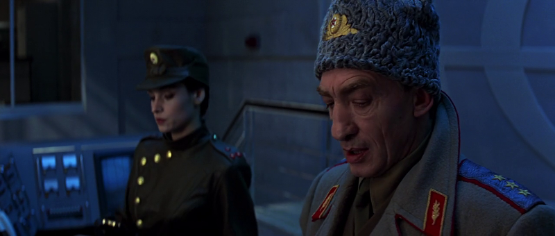 Xenia Onatopp (played by Famke Janssen) and General Ourumov (played by Gottfried John) arm the GoldenEye satellite in GoldenEye (1995)