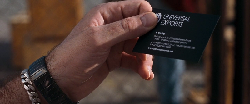 Bond hands over his UnivEx business card to Dominic Greene's goon when trying to meet with Greene
