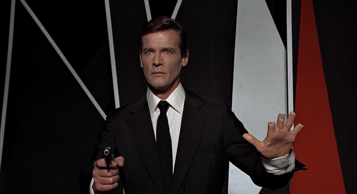 A statue of James Bond (Roger Moore) has its hands shot by Scaramanga in The Man with the Golden Gun (1974)