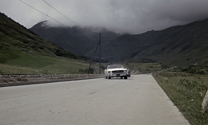 Tilly Masterson's Mustang is pushed off the road by James Bond in Goldfinger (1964), causing her to get a wicked case of whiplash